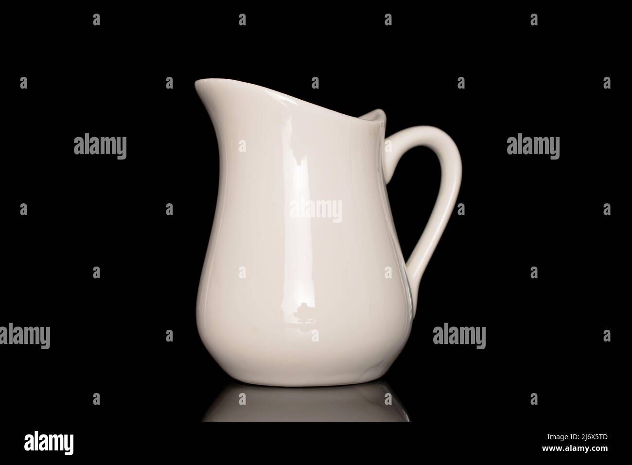 White Ceramic Milk Pot On A White Background Stock Photo, Picture and  Royalty Free Image. Image 50381901.