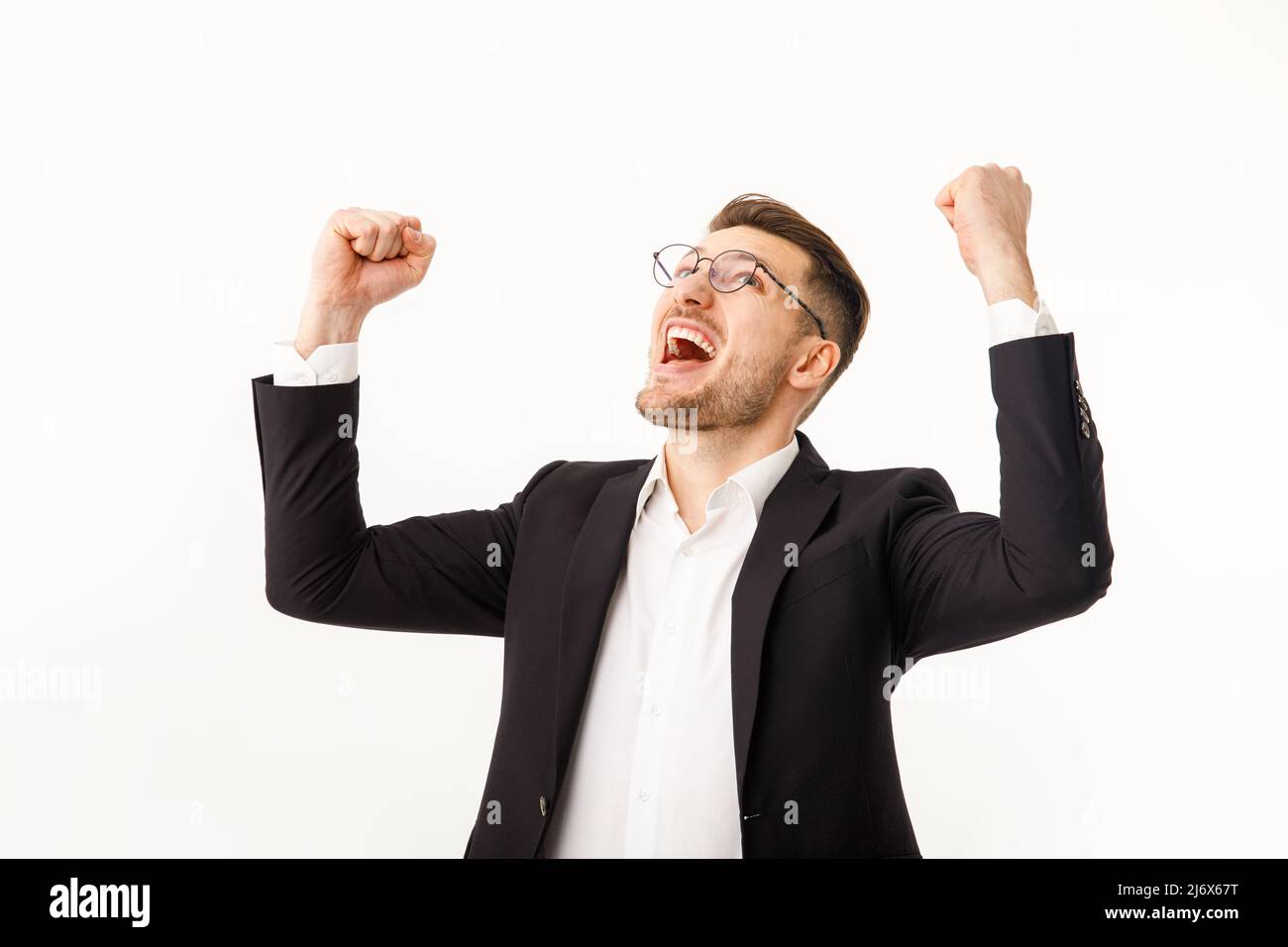 Successful and excited business man cheering with joy while