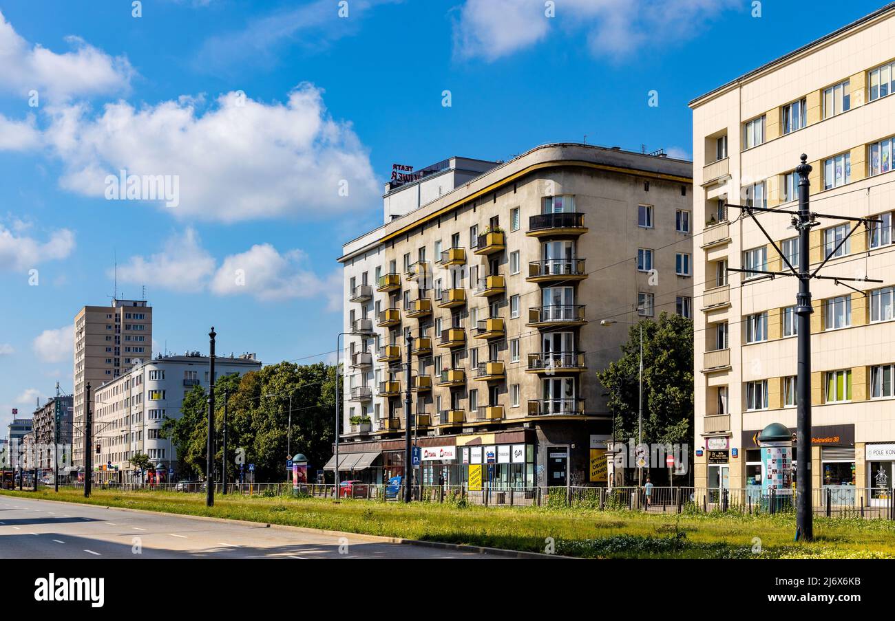 Warsaw, Poland - July 11, 2021: Panoramic view of Pulawska street with historic residential building and Skwer Broniewskiego park square in Mokotow di Stock Photo