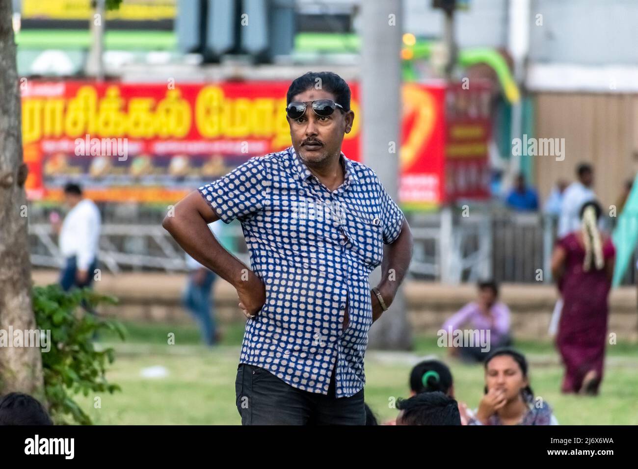 Vellore Tamil Nadu India September 2018 A candid portrait of an Indian man wearing dark glasses standing with his hands on his hips in a public p Stock Photo Alamy