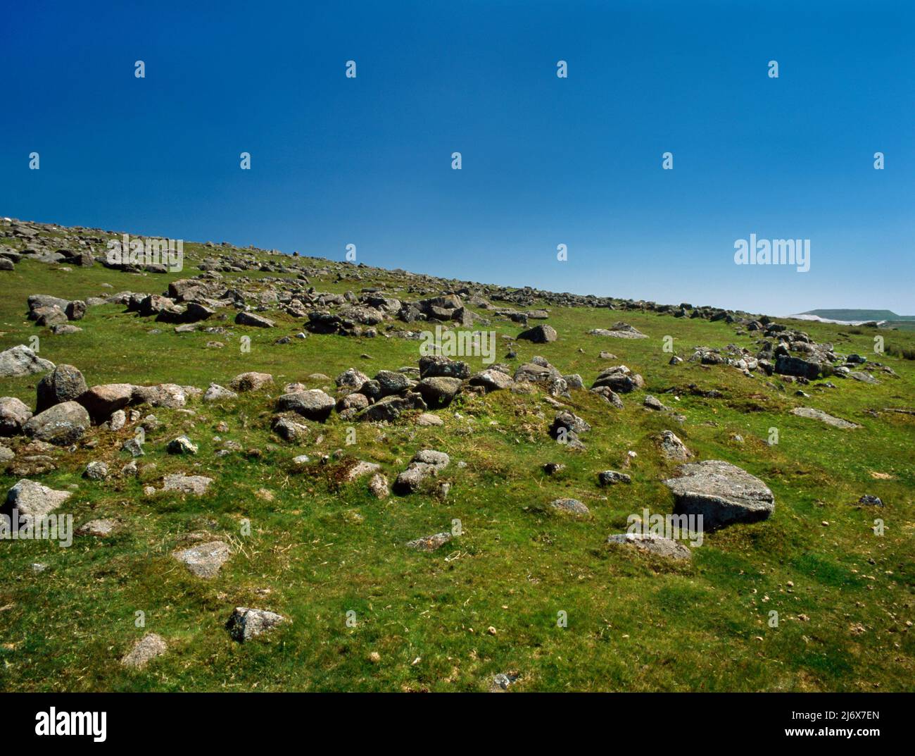 View SE of a Bronze Age enclosed settlement containing 6 hut circles on the W slopes of Little Trowlesworthy Tor, Dartmoor, Devon, England, UK. Stock Photo