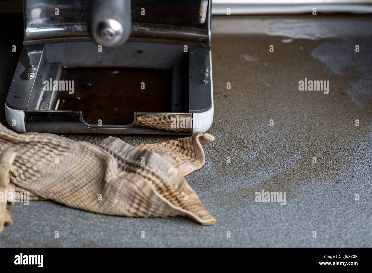 The coffee machine has broken down and needs to be repaired. Leaked,  spilling coffee on the kitchen table Stock Photo - Alamy