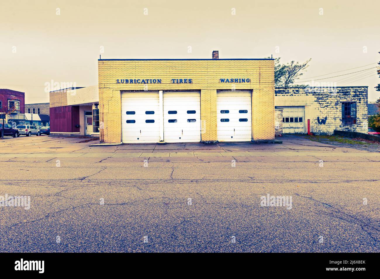 Classic design automobile repair shop, now torn down, with signage
