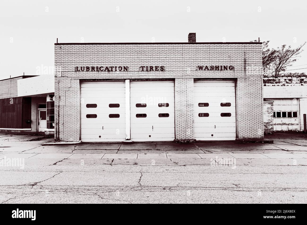 Classic design automobile repair shop, now torn down, with signage