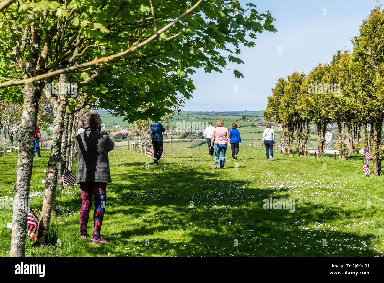 Kinsale, West Cork, ireland. 4th May, 2022. The sun shone in Kinsale today as tempereatures reached 18C. A group of American tourists visited the 9/11 Memorial Garden in Kinsale. Met Éireann has forecast a sunny weekend with temperatures likely to reach 20C. Credit: AG News/Alamy Live News. Stock Photo
