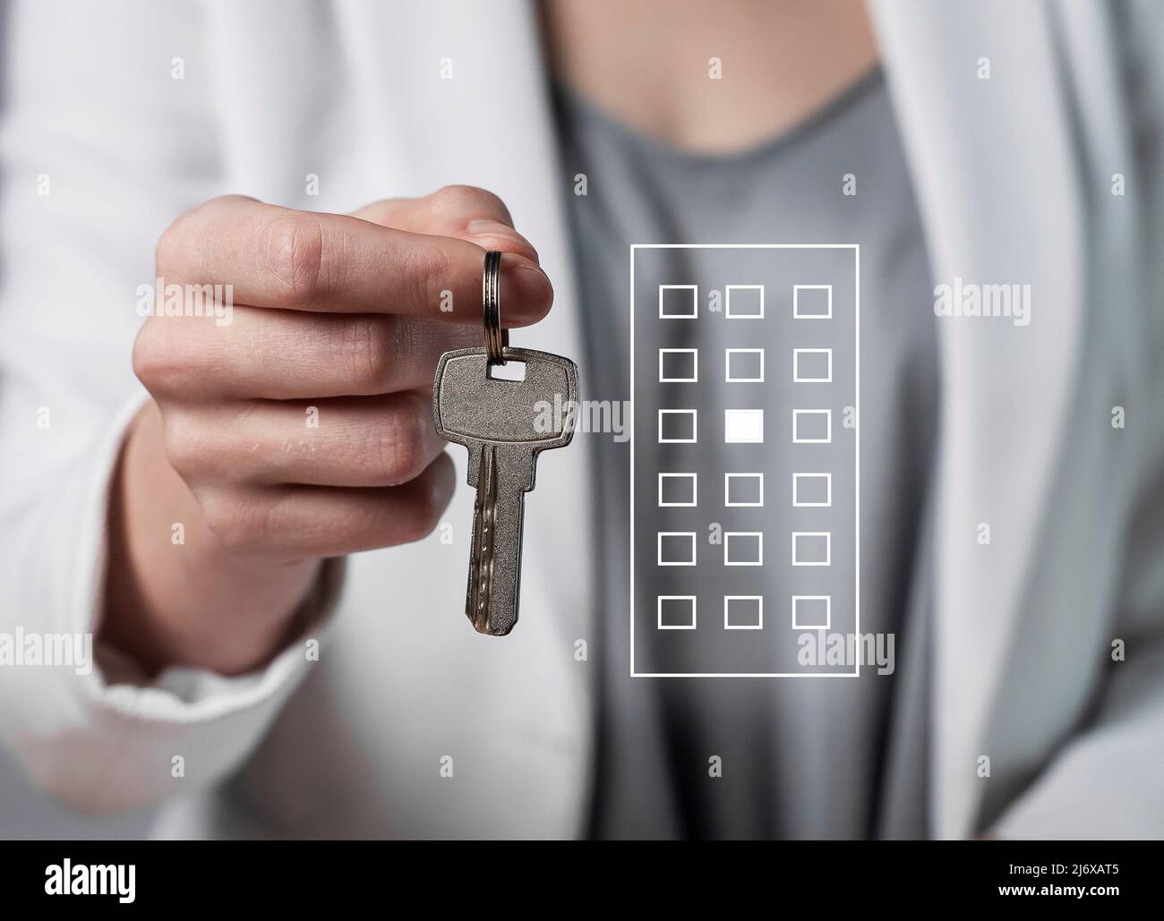 Woman hand with apartment keys closeup. Real estate purchase or house rent. Moving into new home concept. High quality photo Stock Photo