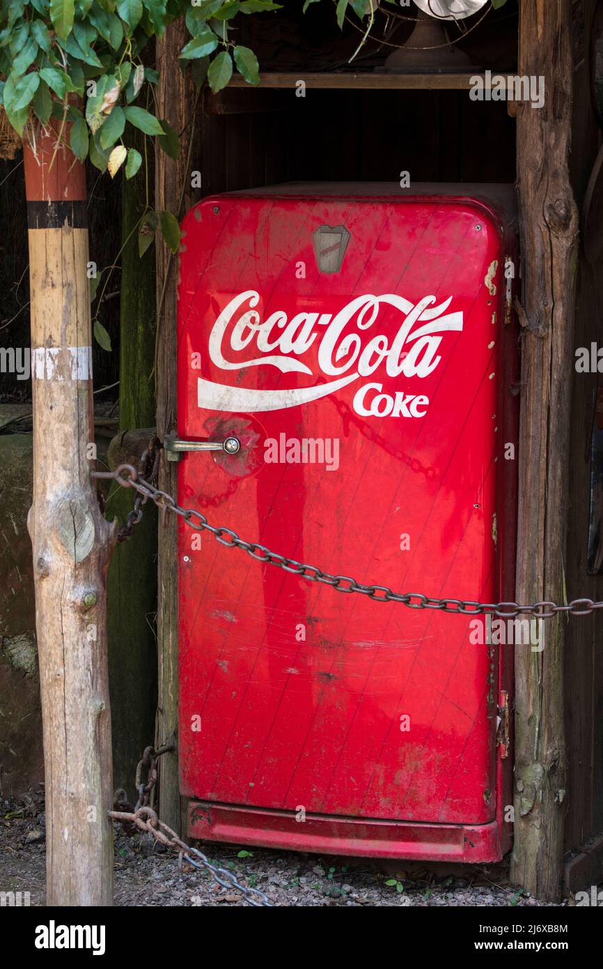 Old red vintage Coca Cola Frigidaire refrigerator / fridge Stock Photo