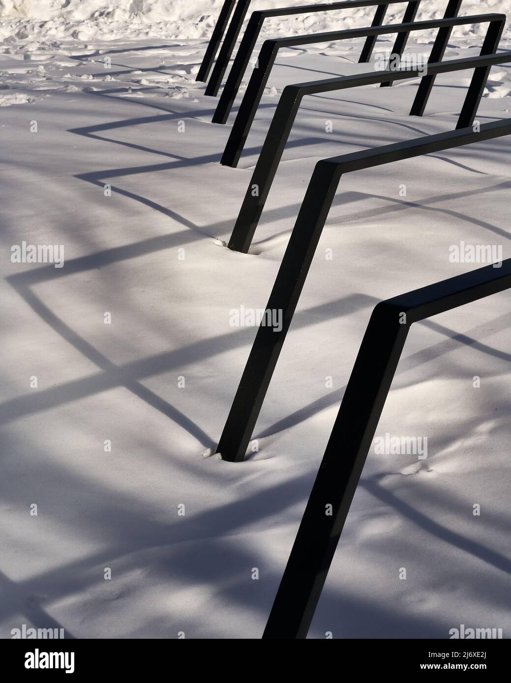 contemporary designed bike rack in the snow Stock Photo