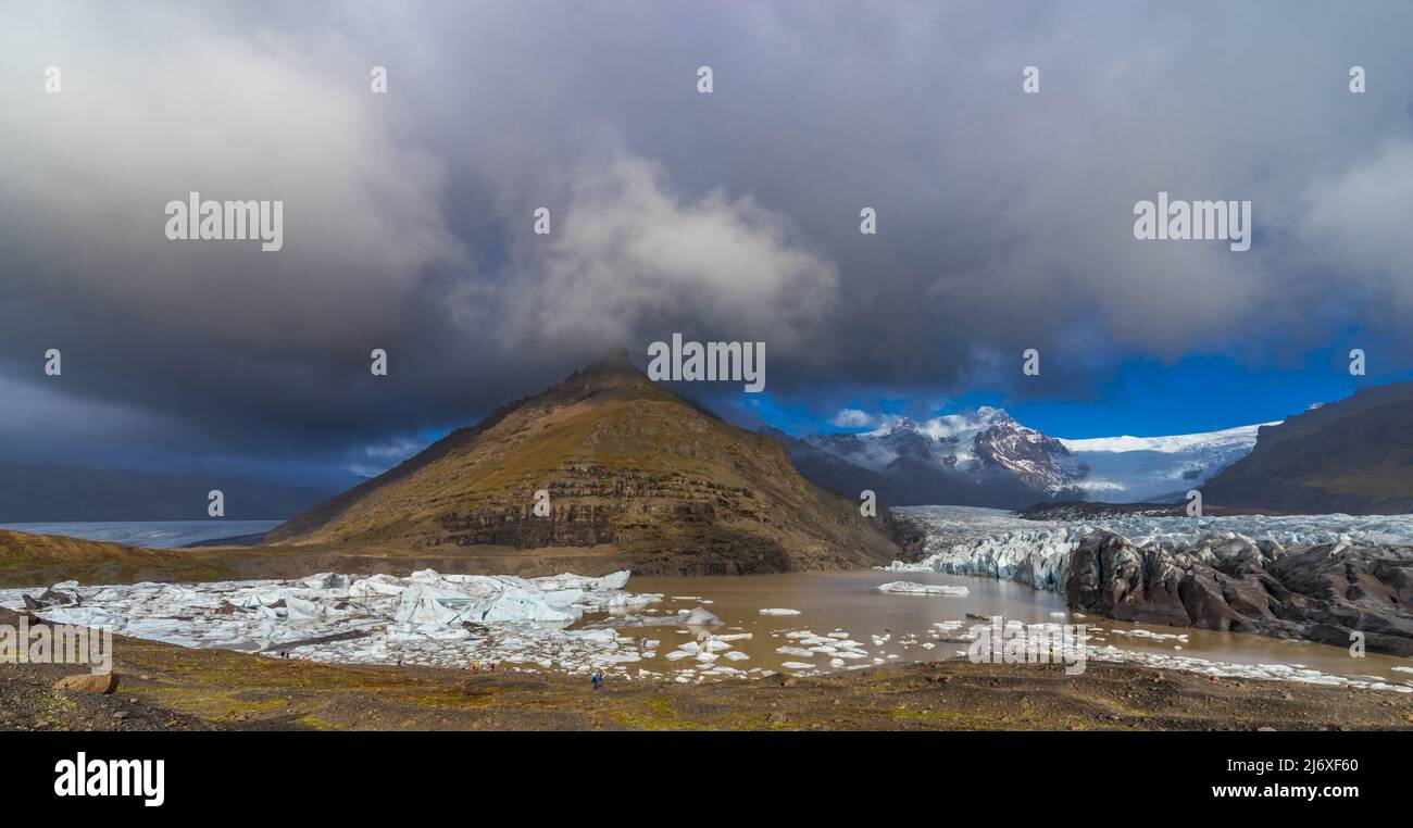 Glacier tongue end melting and forming a lake, a tourist attraction Stock Photo