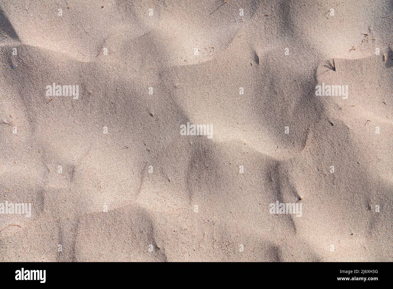 Sand texture background, top view. Sandy beach rippled. Natural material close up. Summer vacation concept. Stock Photo
