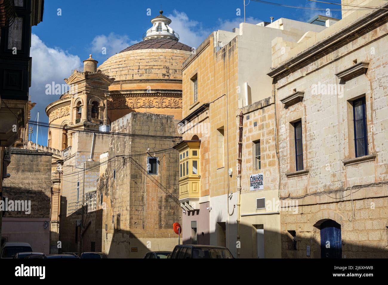 The Mosta Rotunda seen from the back streets of the town, Malta Stock Photo