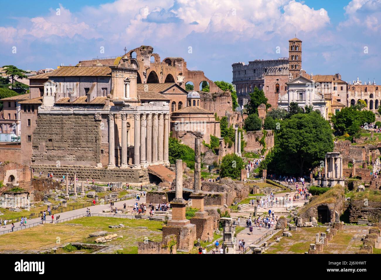 Rome, Italy - May 25, 2018: Panorama of Roman Forum Romanum with Temple of Antoninus and Faustina San Lorenzo in Miranda church, Colosseum and Via Sac Stock Photo