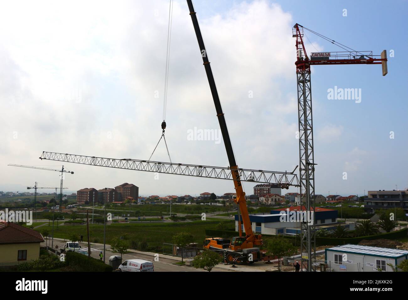 Horizontal jib of a tower crane being lifted into position by a truck ...