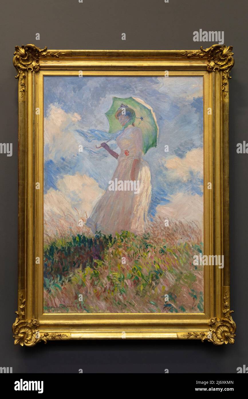Woman with a Parasol Facing Left (1875) - oil painting by Caude Monet on display at Musee d'Orsay, Paris, France Stock Photo