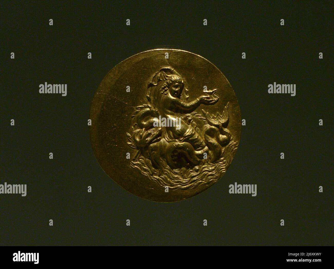 Medaillon depicting a Nereid riding a sea dragon. Aboukir Medallions. 3rd-4th centuries. Found in Abukir (Egypt). Greek. Gold. Calouste Gulbenkian Museum. Lisbon. Portugal. Stock Photo
