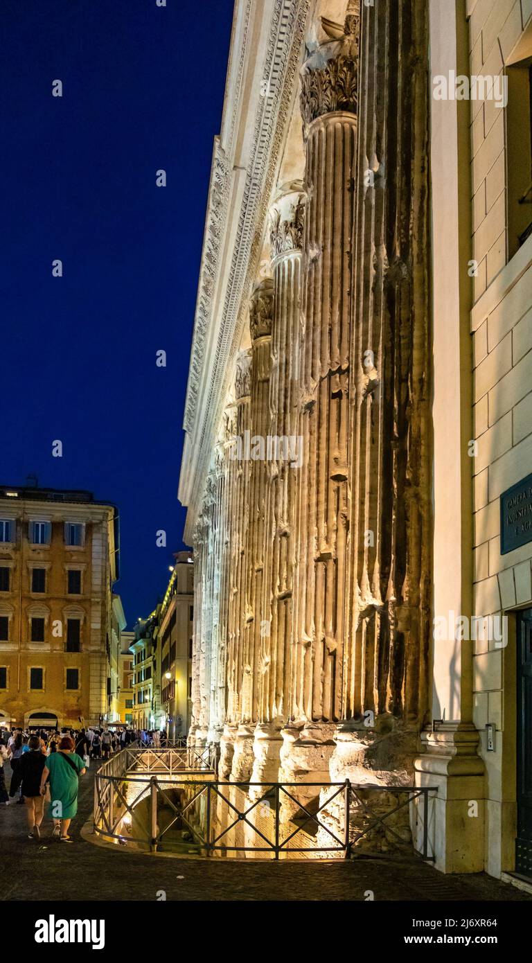 Rome, Italy - May 25, 2018: Hadrian Temple ancient wall with colonnade now facade of Chamber of Commerce stock exchange at Piazza di Pietra square in Stock Photo