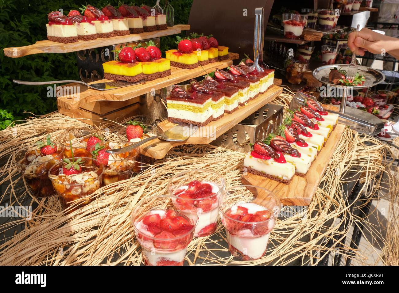 red strawberry cookies and pastries, food festival, sweet food and dessert table setting. Stock Photo