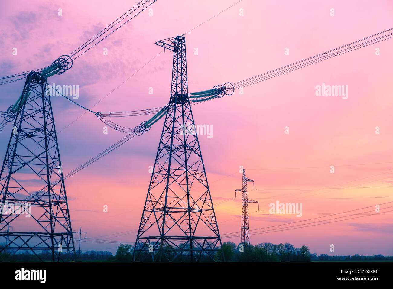 Electric high voltage post, High voltage energy transmission. Grid of high voltage post.High-voltage tower sky background. Power distribution. Stock Photo