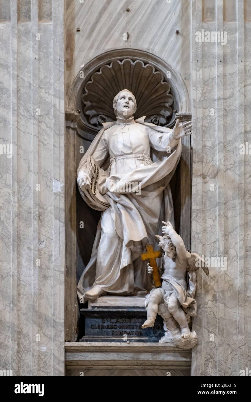 Rome, Italy - May 27, 2018: Founder statue of St. Camillus de Lellis by Pietro Pacilli at left nave of papal St. Peter's Basilica, San Pietro in Vatic Stock Photo