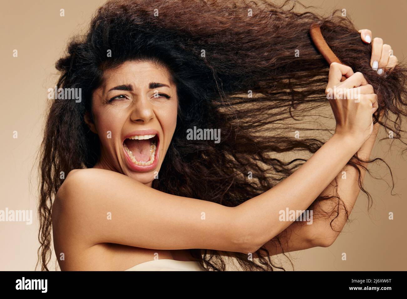HAIR LOSS. TANGLED HAIR CONCEPT. Screaming suffering irritated awesome