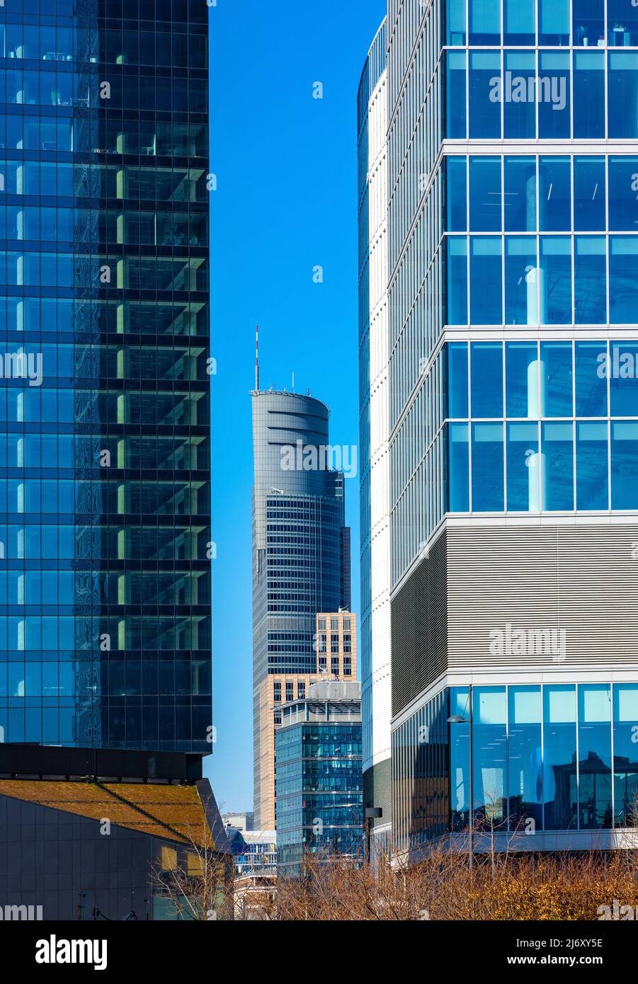 Warsaw, Poland - March 18, 2022: Warsaw Trade Tower between Skyliner Tower and Warsaw Hub in Wola business district of Warsaw city center Stock Photo