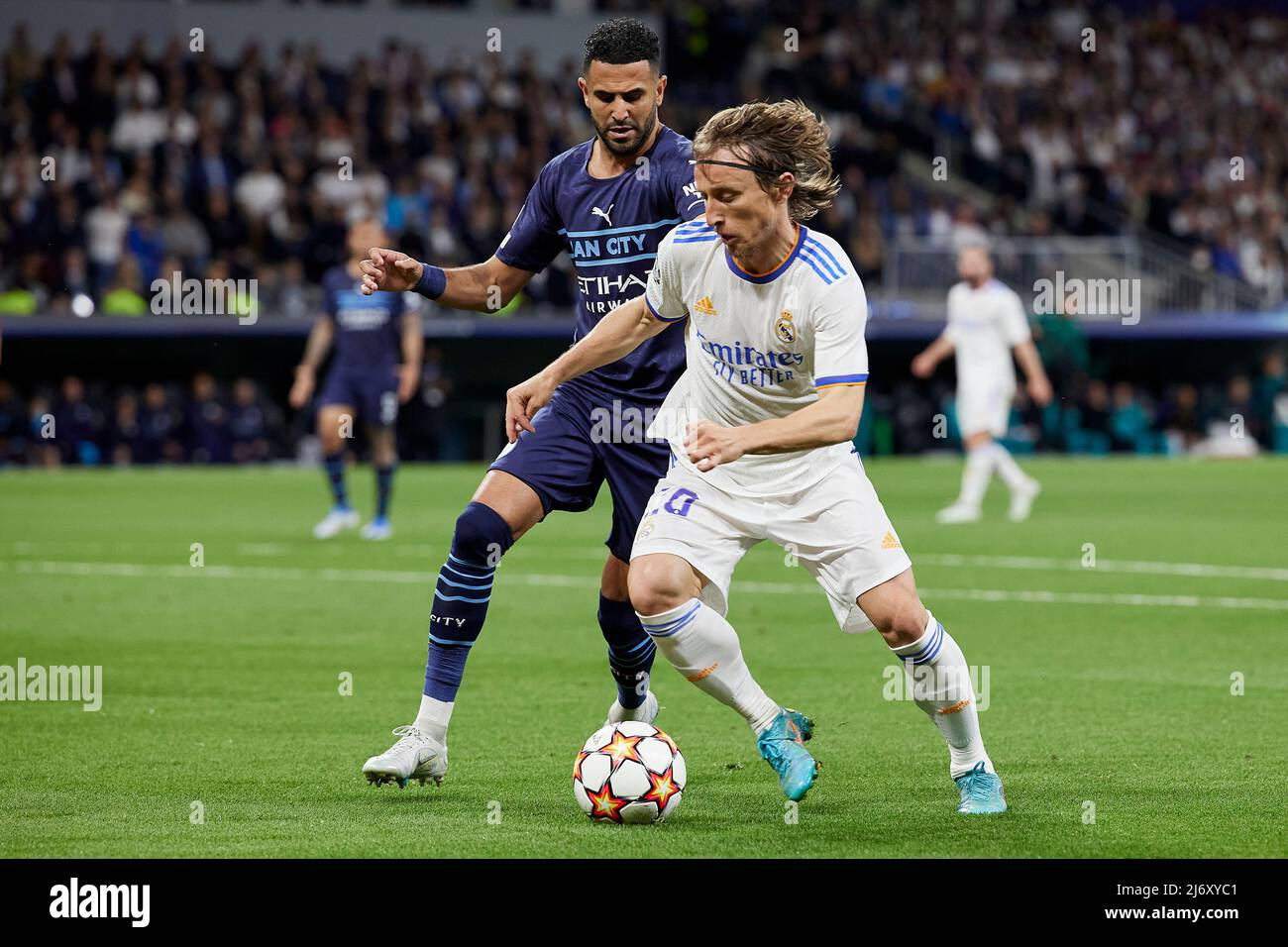 Madrid, Spain. 04th May, 2022. Luka Modric of Real Madrid and Riyad Mahrez of Manchester City during the UEFA Champions League match between Real Madrid and Mancheaster City played at Santiago Bernabeu Stadium on May 4, 2021 in Madrid Spain. (Photo by Ruben Albarran/PRESSINPHOTO) Credit: PRESSINPHOTO SPORTS AGENCY/Alamy Live News Stock Photo
