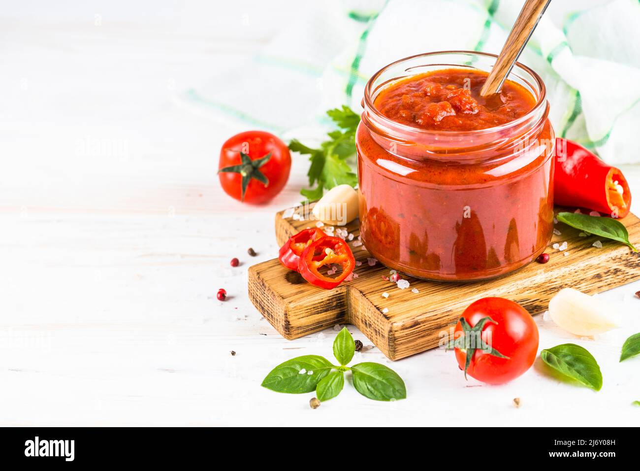 Tomato sauce with herbs and spices at white background Stock Photo Alamy