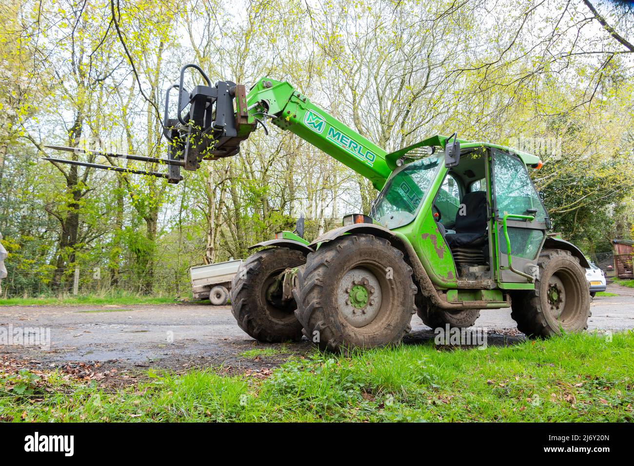 green telescopic handler on farm in northumberland Stock Photo - Alamy