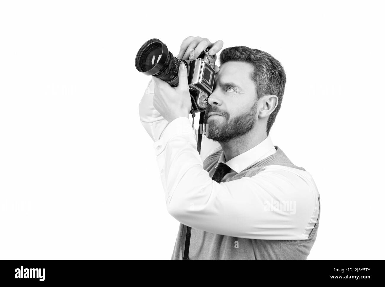photographer making photo with professional camera isolated on white, copy space, photographing. Stock Photo