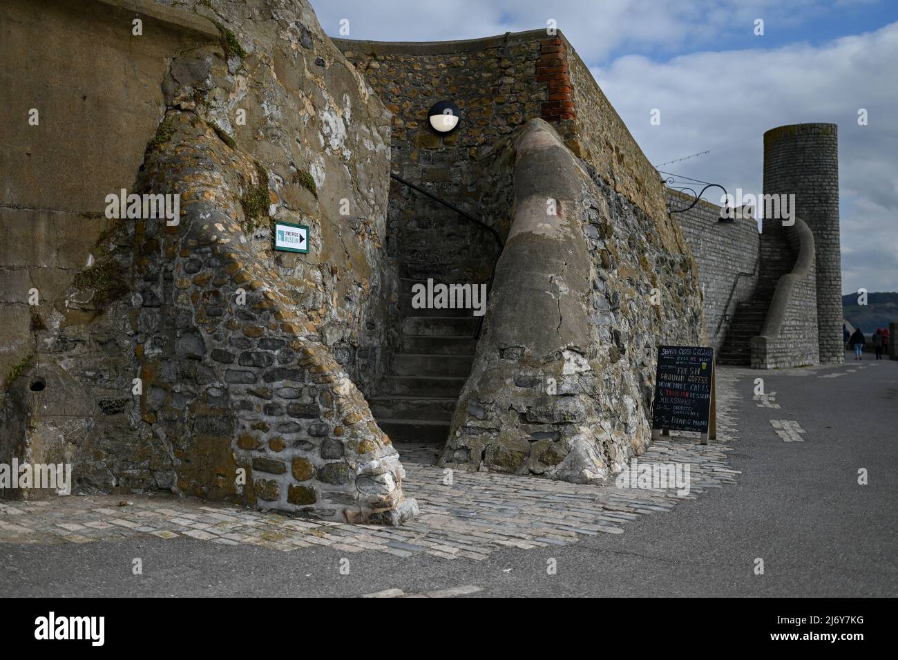 walkway steps heritage stone wall and walkway at seafront Lyme Regis Stock Photo