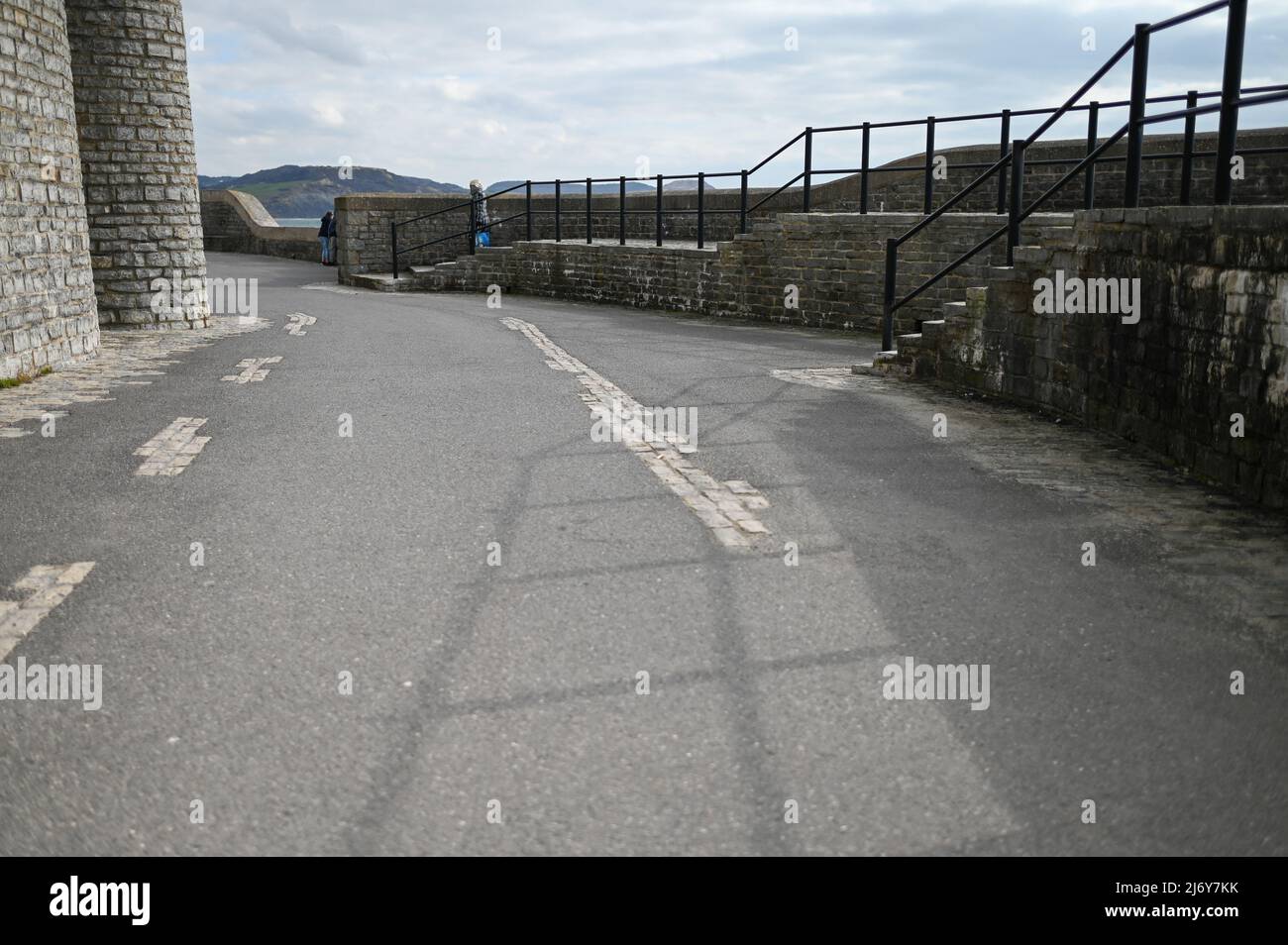 walkway steps heritage stone wall and walkway at seafront Lyme Regis
