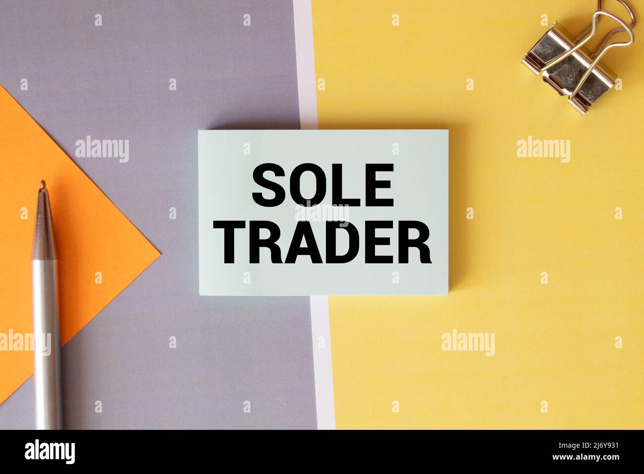 SOLE TRADER, text on white notepad on craft background. Stock Photo