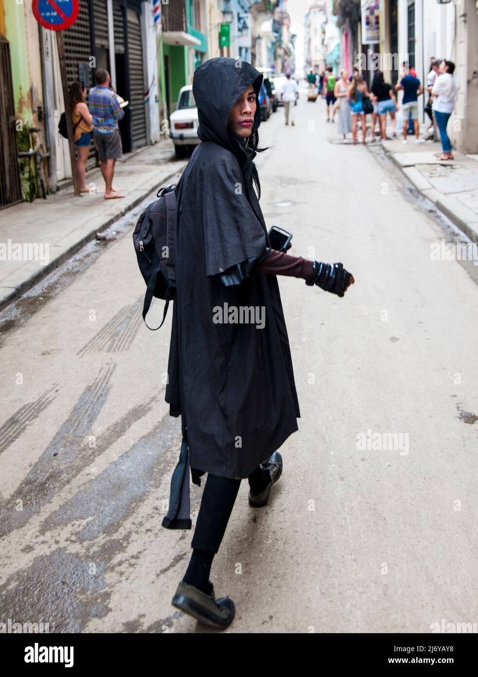 Drag Queen transexual with attitude walking through the middle of the street in Havana, Cuba. Stock Photo