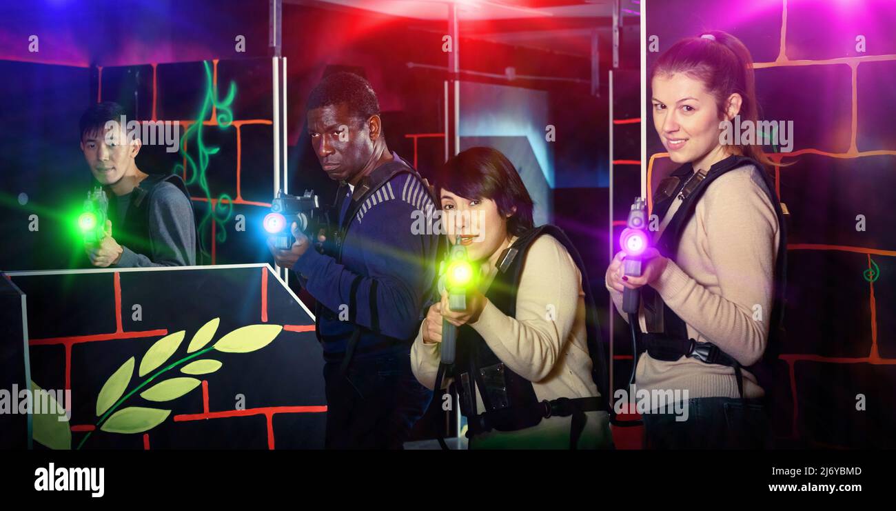 Modern People Of Different Nationalities With Laser Pistols Play Stock modern-people-of-different-nationalities-with-laser-pistols-play-stock