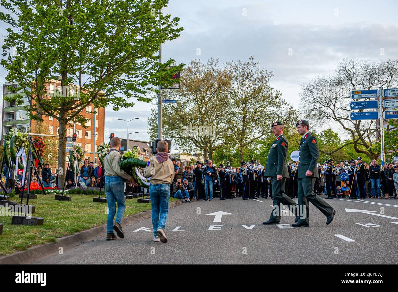 Two military officers are seen walking to put a wreath of flowers at ...