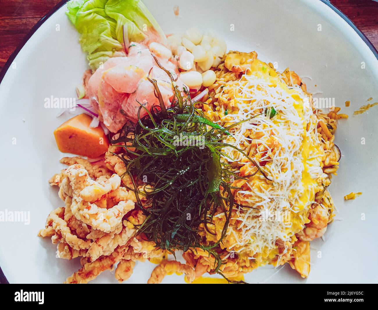 Ceviche with seafood rice and fish chicharron. Peruvian food, seafood trio Stock Photo