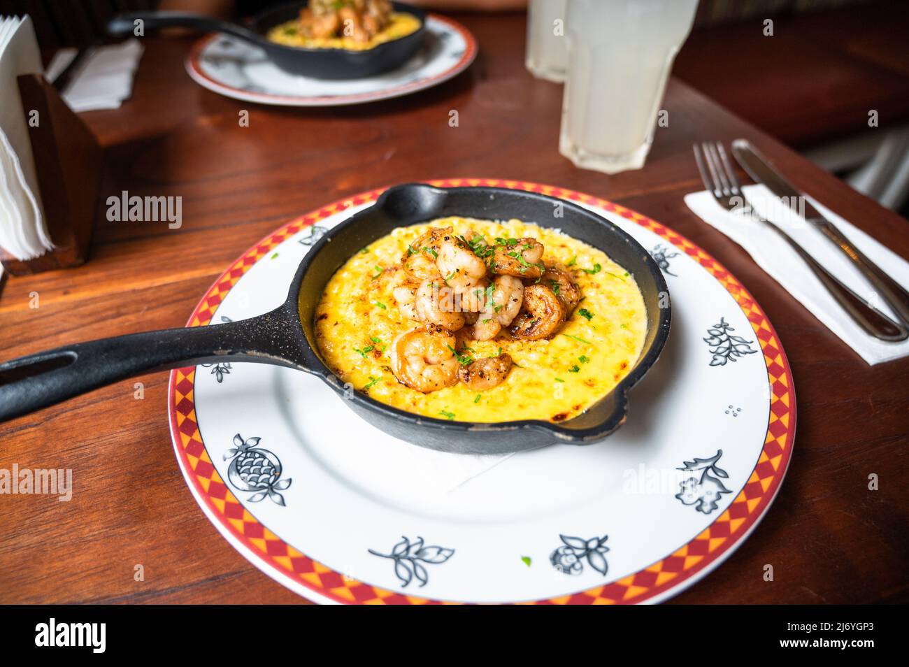 Macaroni and cheese and prawns also called mac and cheese served in a