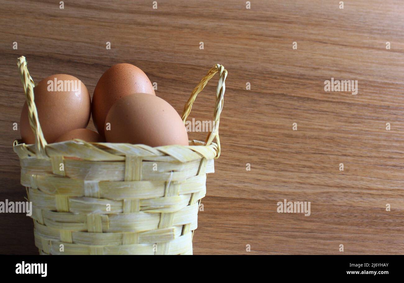 raw eggs in a basket Stock Photo
