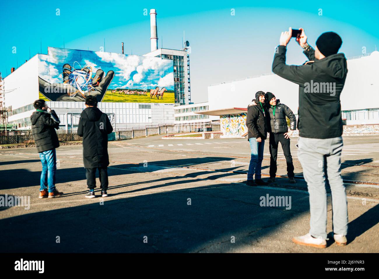 A group of tourists is photographed in front of the nuclear power plant ...