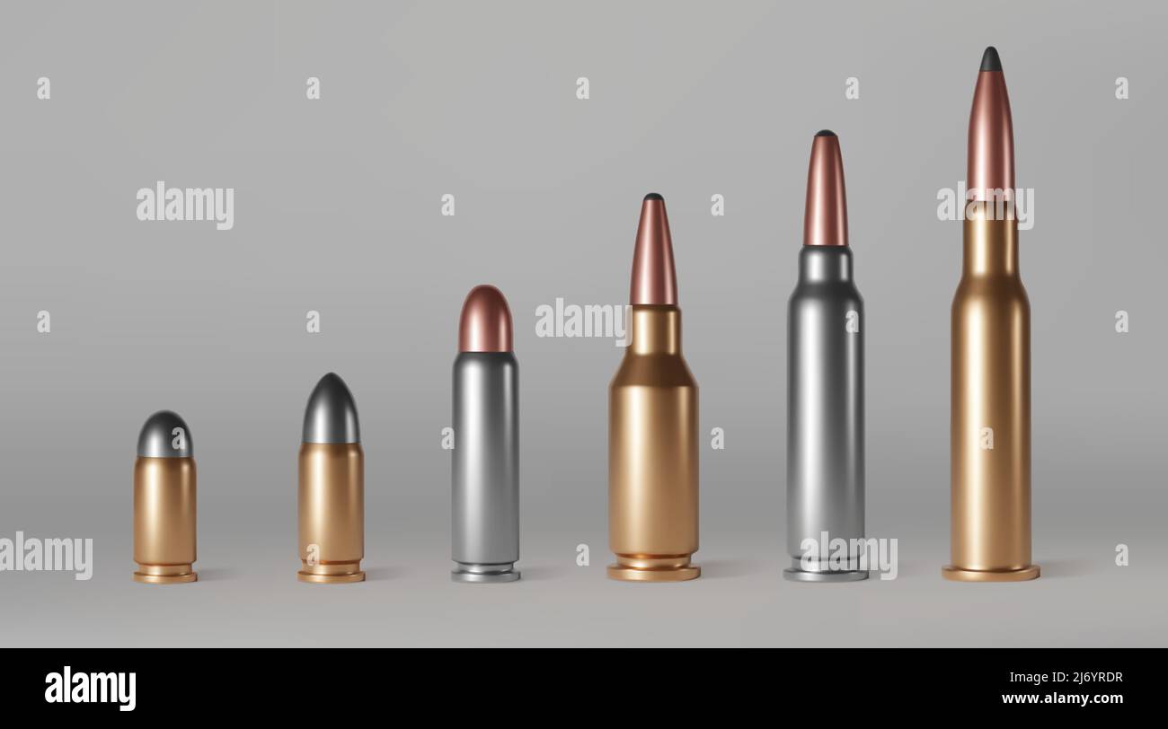 Bullets of different calibers stand in row. Copper, gold or silver