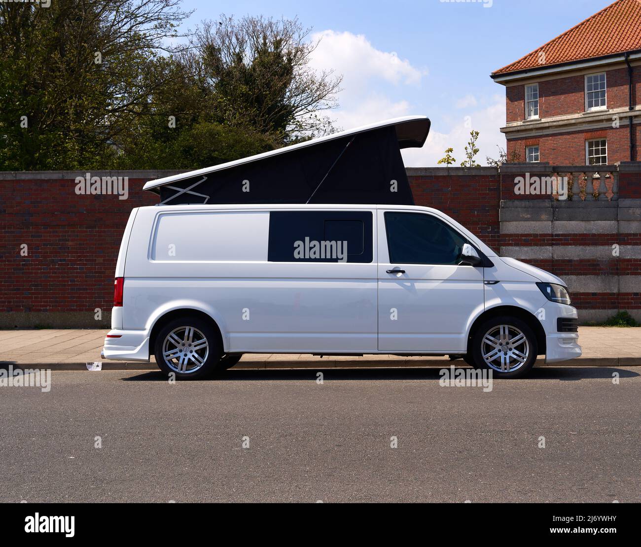 White VW camper van with awning roof Stock Photo Alamy