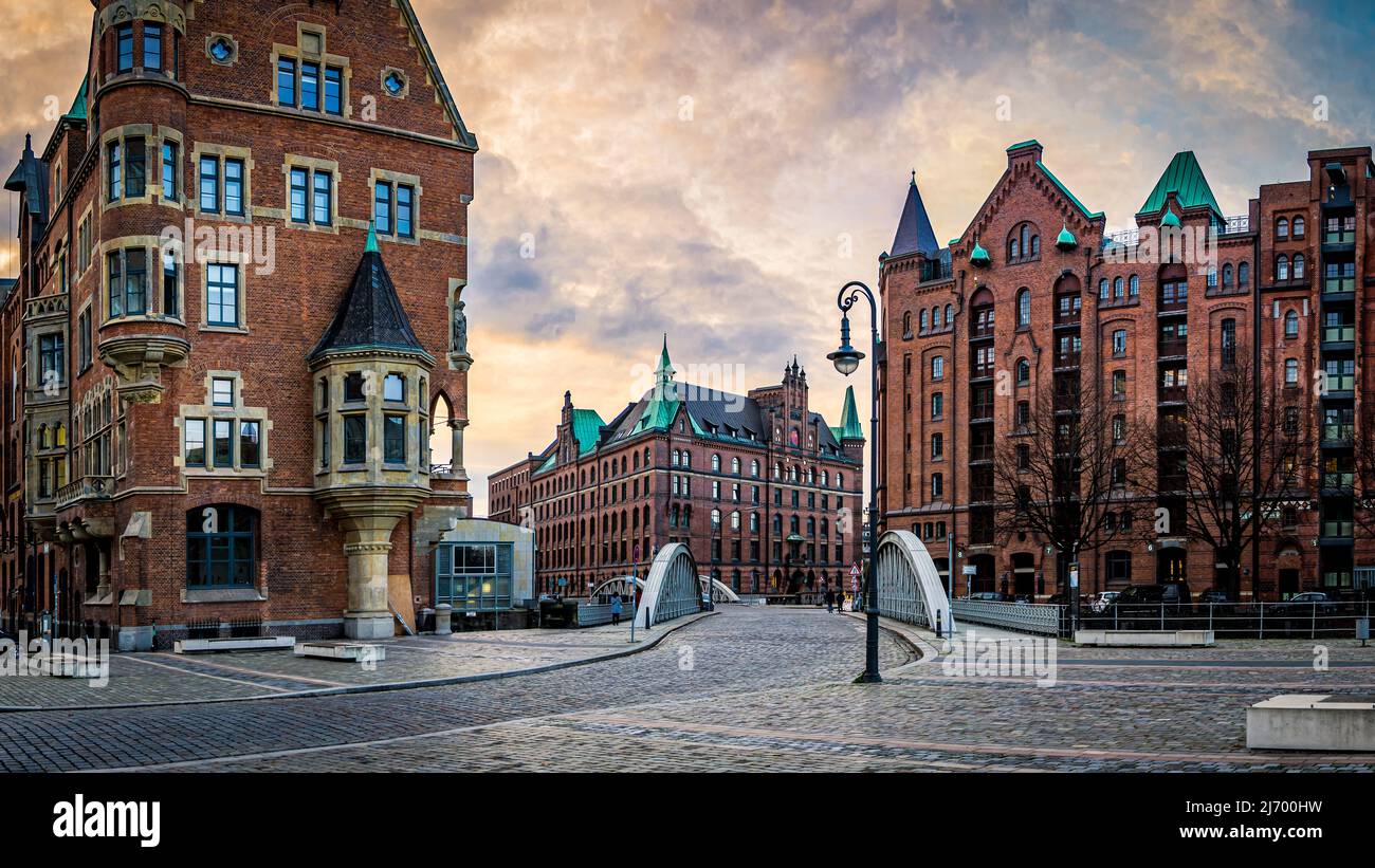 panoramic view of the Neuerwegsbrücke connecting St. Annenplatz with Sandtorkai in the speicherstadt, famous traditional warehouse district. Stock Photo