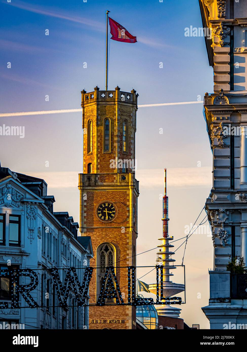 Portrait photography with view from the famous renaissance style clock tower called alte post to the television tower called heinrich hertz tower. Stock Photo