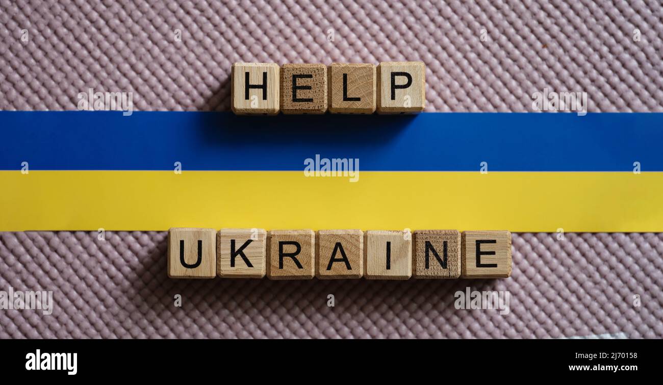 Help Ukraine Sign Help Ukraine text and Ukrainian flag closeup Stock Photo - Alamy
