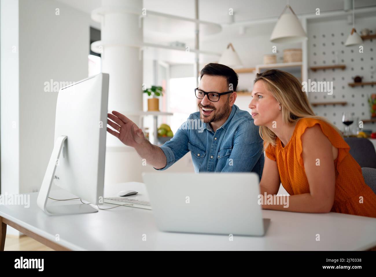 Programmers cooperating at IT company developing apps Stock Photo