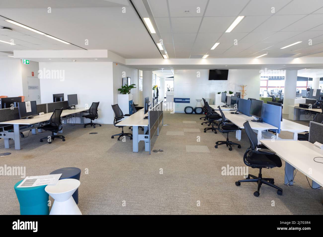 Open plan corporate offices deserted during Covid 19 with workers directed to work from home,Sydney,NSW,Australia Stock Photo