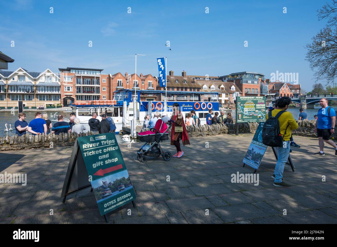 People wait to board a cruise boat, operated by French Brothers, for a