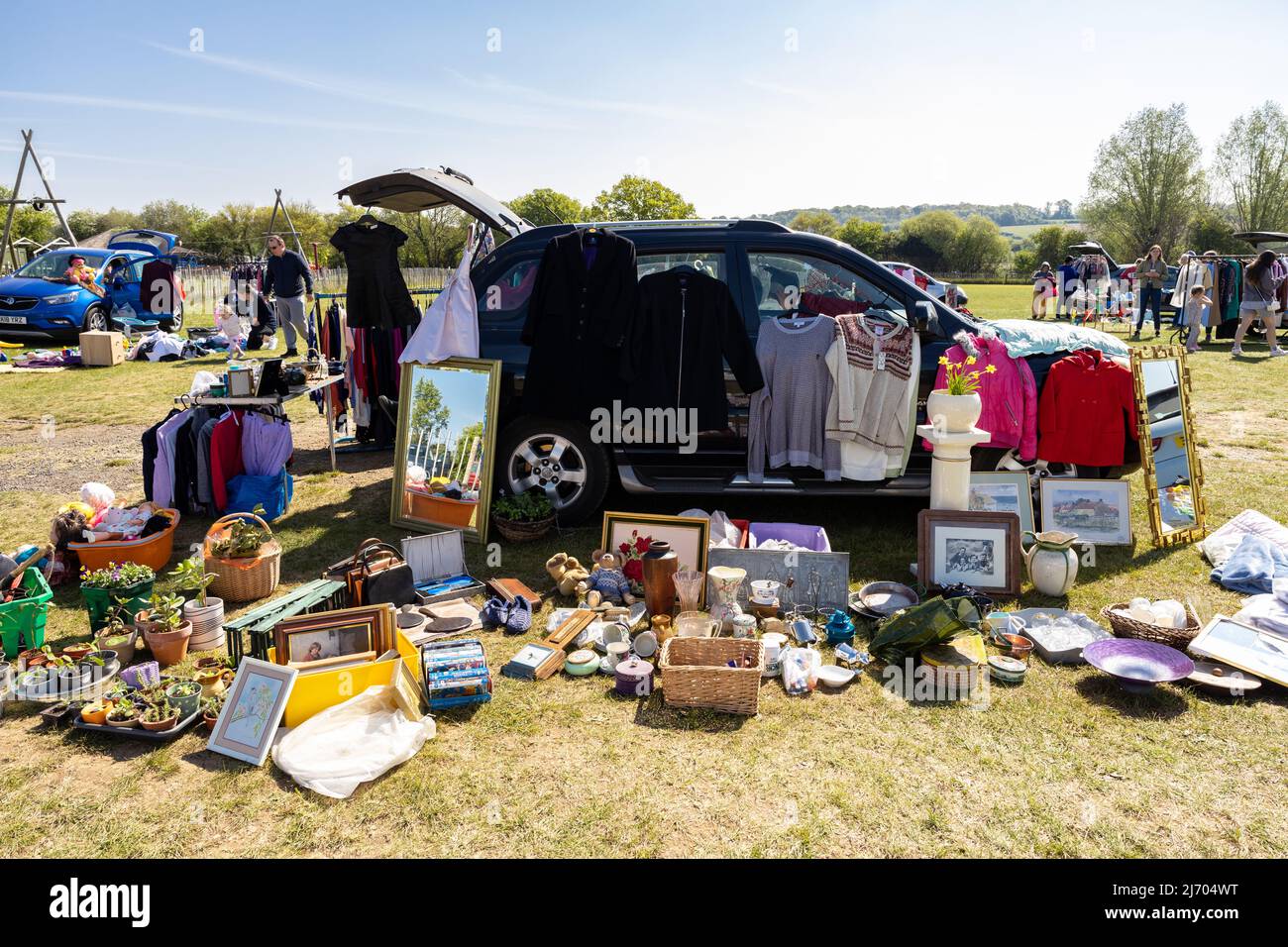 Weekend car boot sale attracts people looking for cheap bargains and secondhand used items as the economic hardship tightens and interest rate rises Stock Photo