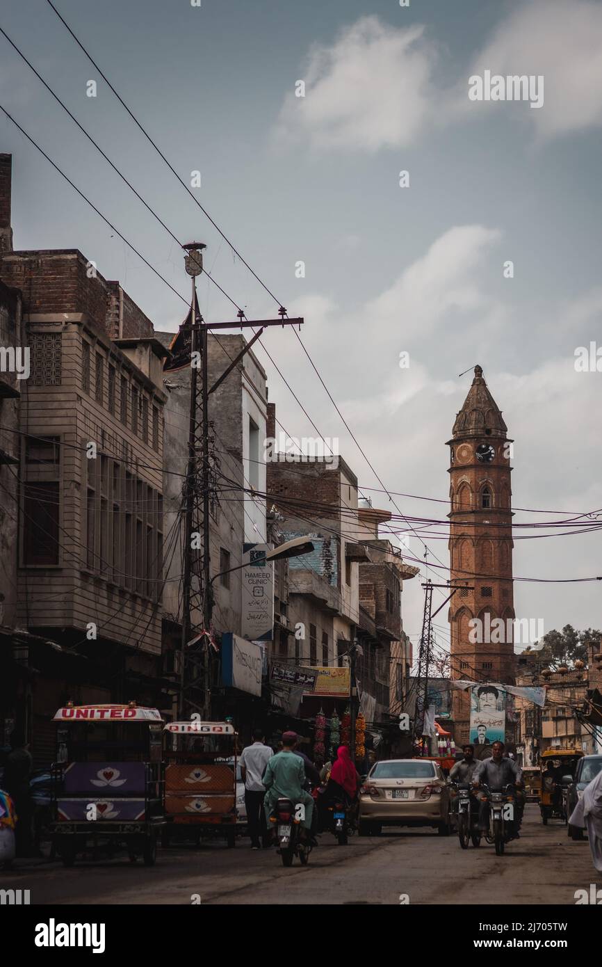 Gujranwala ancient clock tower during sunny and cloudy day Stock Photo