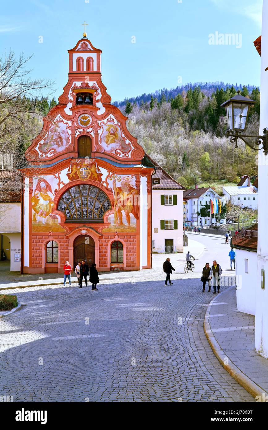 Germany Bavaria Romantic Road. Fussen. Heilig-Geist-Spitalkirche (Holy Spirit Hospital Church) and its rococo painted facade Stock Photo